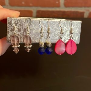 Never worn!  3 pairs of dangle earrings